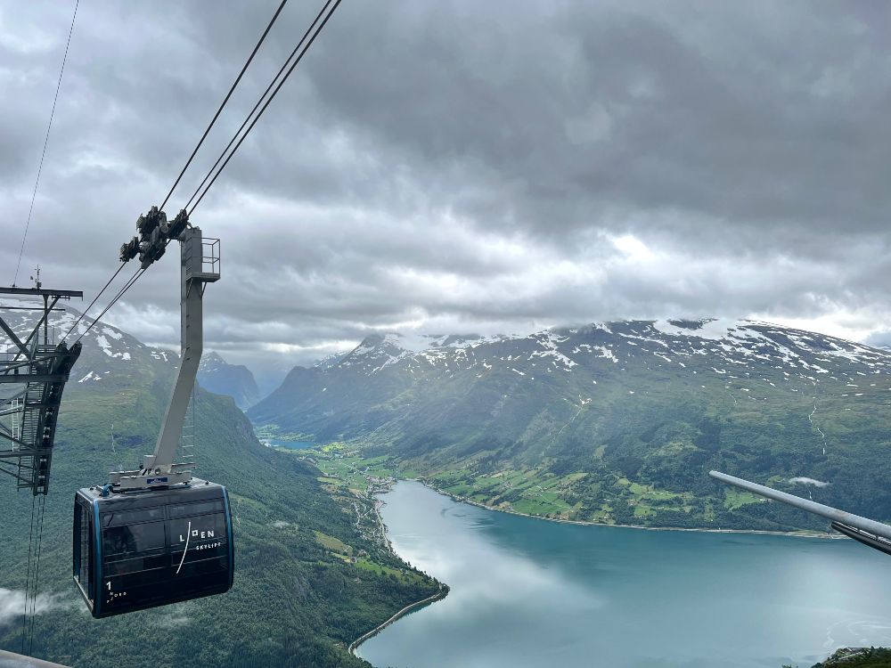 A cable car high above the norwegian fjord below